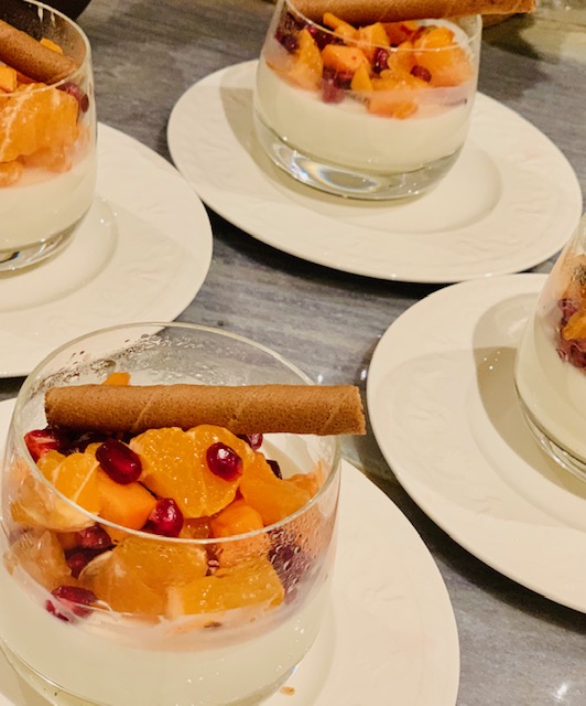 vanilla coconut panna cotta with persimmons, oranges and pomegranates